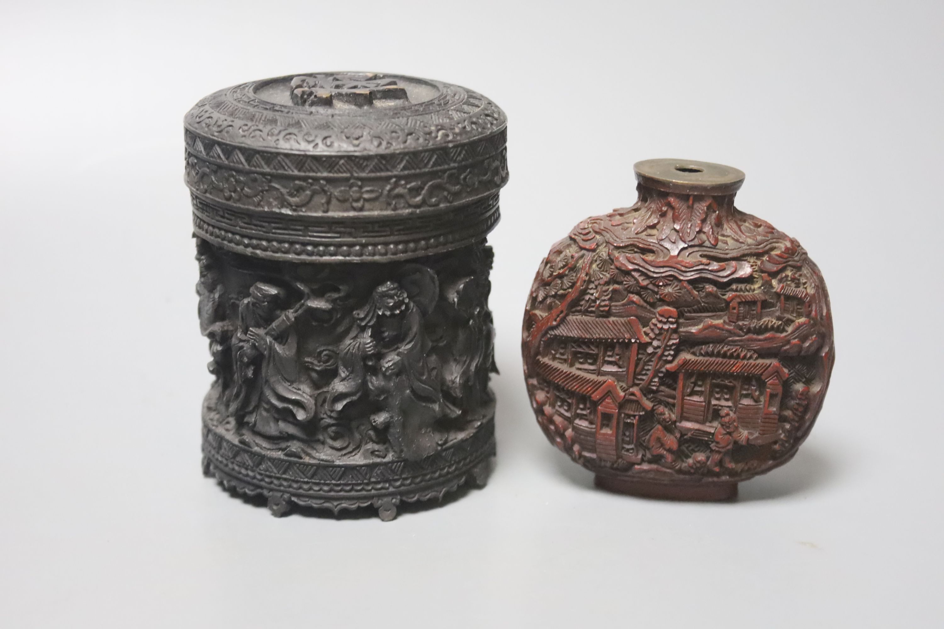 Five Chinese wood carvings including a circular box and a card case, largest 23cm wide